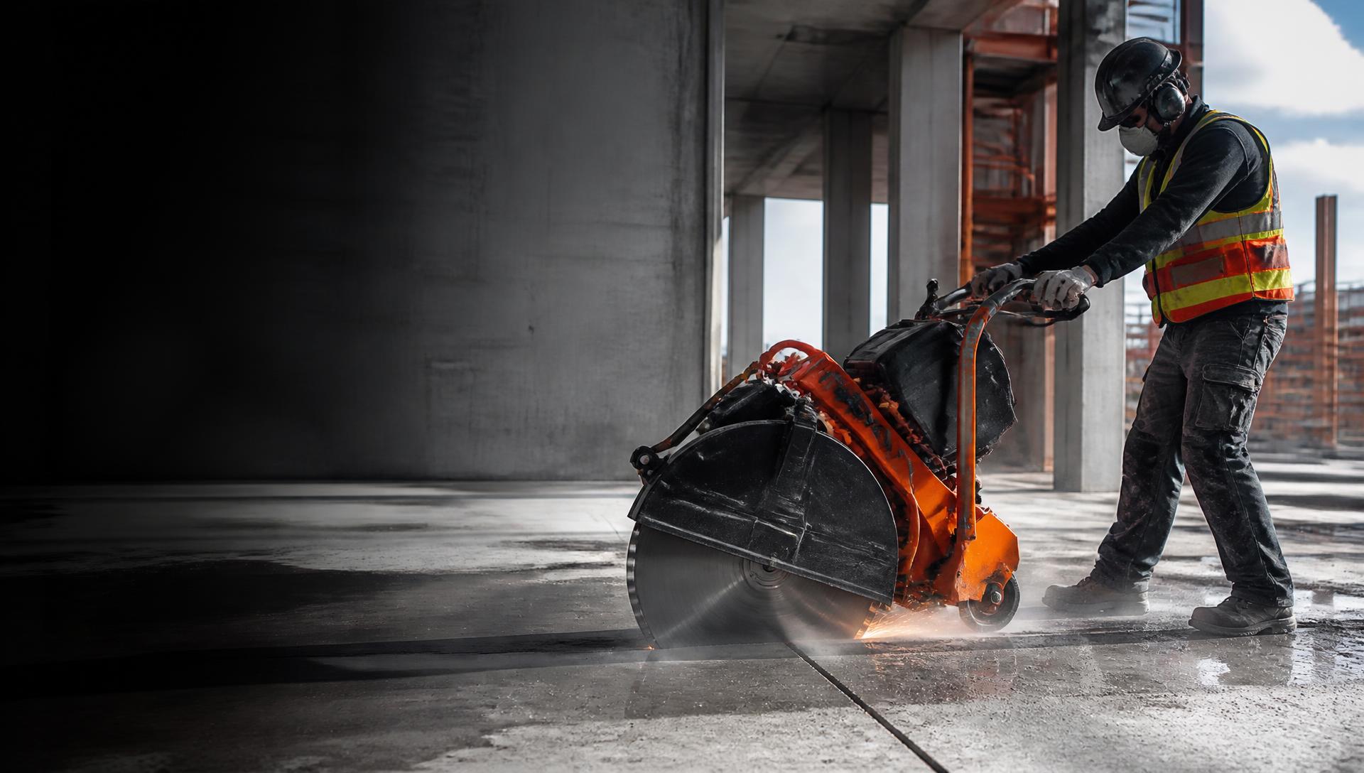 Industrial slab cutting machine cutting a concrete floor